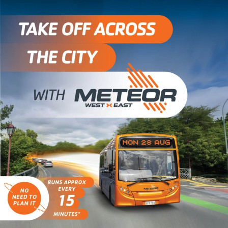 The Meteor bus is heading west on Anzac Parade bridge in Hamilton.